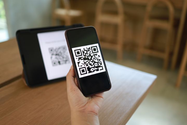 How can you scan a QR code that appears on your phone browser, a news feed, or an email application? 